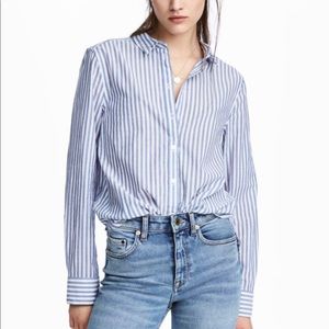 Long sleeve white & blue striped shirt.